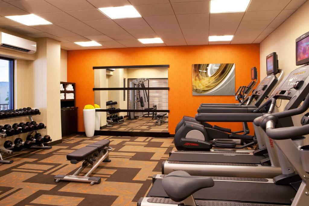 The fitness center, with treadmills, cross-trainers, free weights and a bench