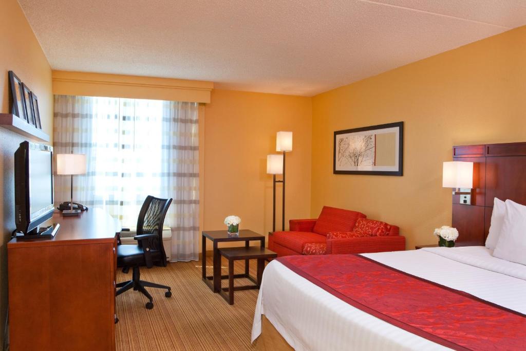 King room with one king bed, work desk and armchair
